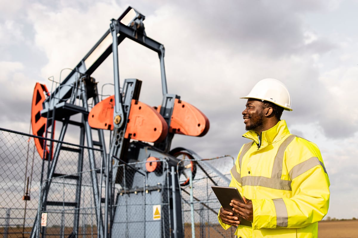Ghanaian SpillGuard responder with a hard hat at an oil field