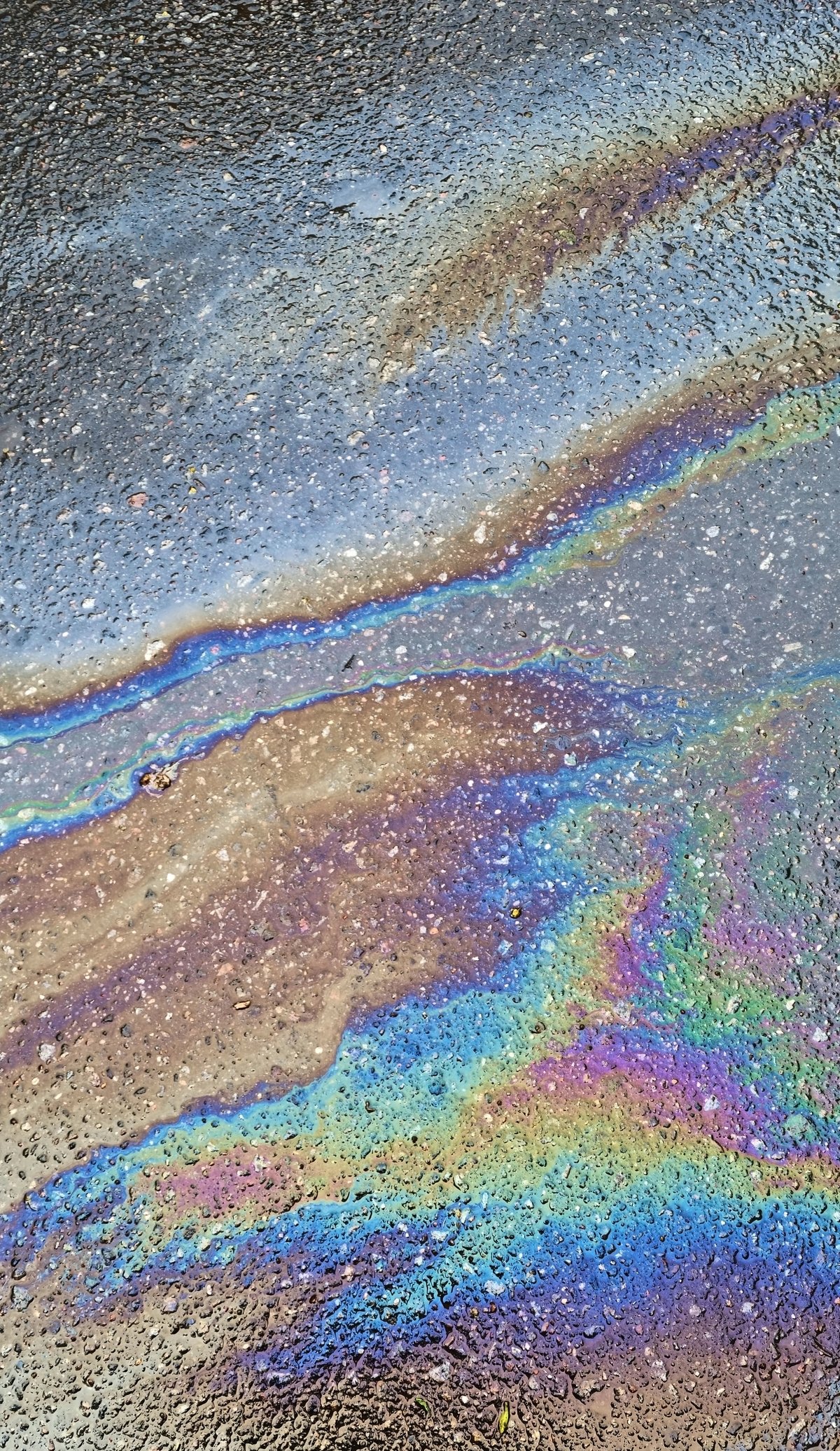 Abstract oil spill on water surface