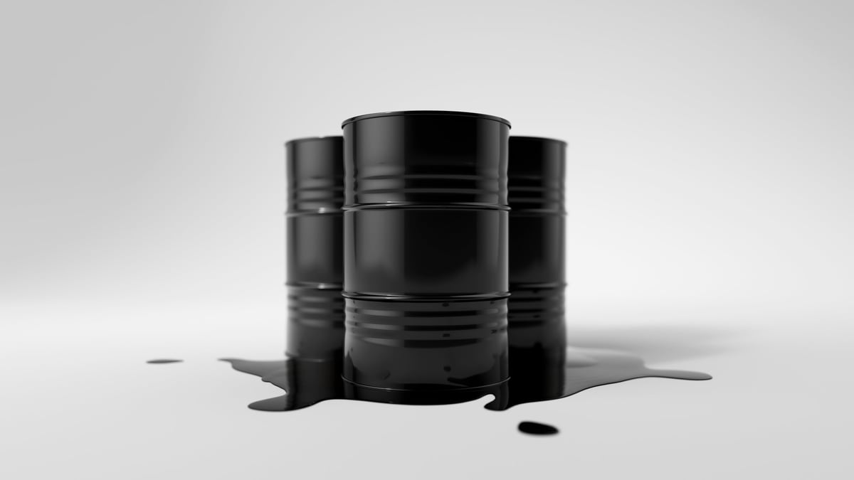 Oil barrels on spilled crude oil