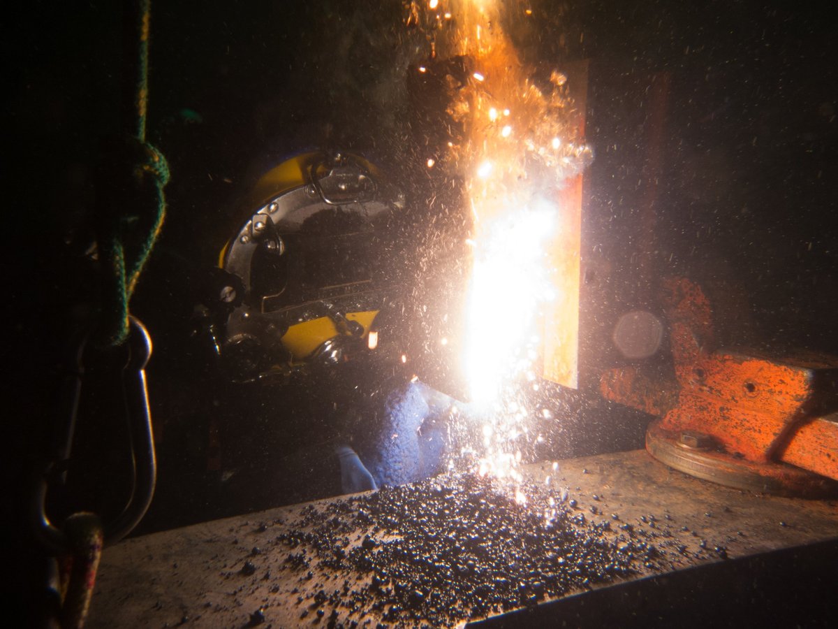 Ghanaian commercial diver working on a submerged industrial structure